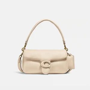 Coach Cream Pillow Bag. In original duster Bag. This bag only has long strap.
